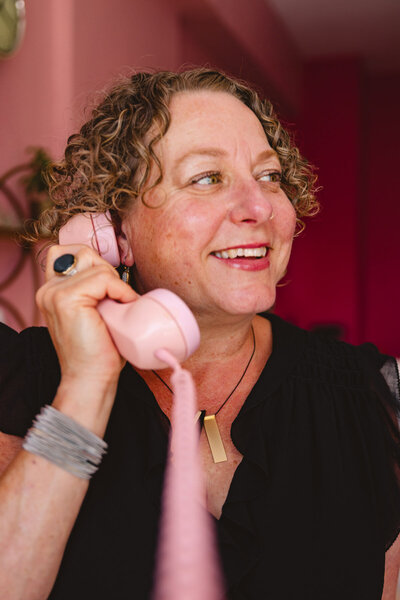 Oregon business lawyer Cassie Peters holds up a pink phone