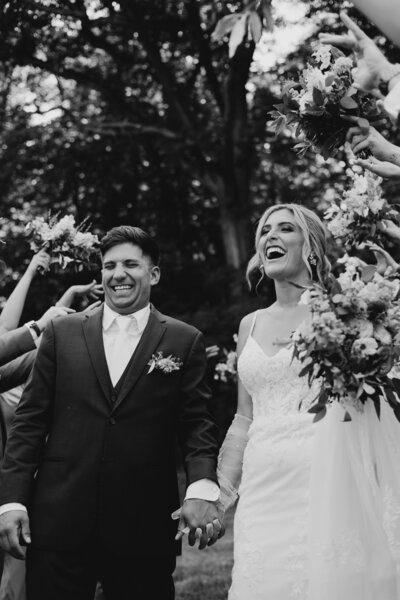 Joyful black and white wedding photo of a couple celebrating, photographed in South Bend, Indiana.