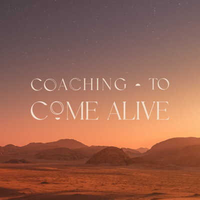 Image of a desert sunset with a cream colored serif logo that reads Coaching To Come Alive on top of the image