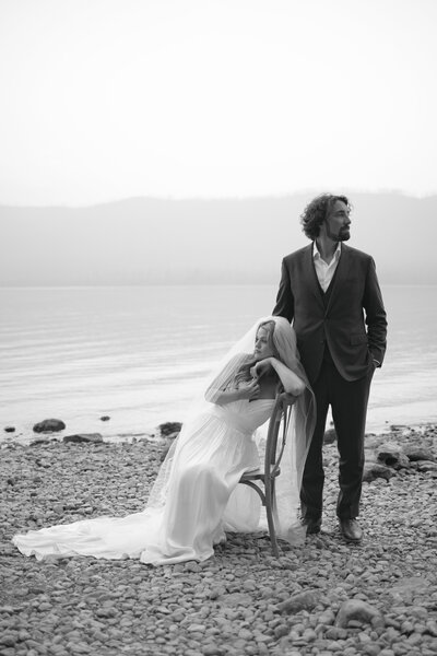 bride-and-groom-hugging-eachother-at-the-beach-during-sunset