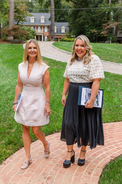 real estate agent team walking toward a house entrance in Atlanta by Laure Photography