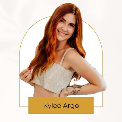 A youthful redhead smiles into the camera, ready to help clients with all their body sugaring needs