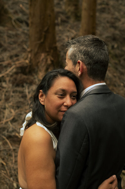 couple kissing and eloping on a mountain in the french alps