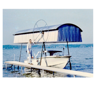 Man standing next to boat lift on Torch Lake in Northern Michigan