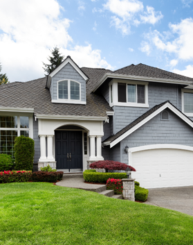 Front view of a renovated house exterior by Black Bear Roofing & Exteriors.