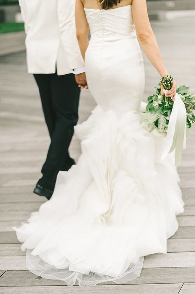 Bride and groom walk up memorial steps at their DC wedding