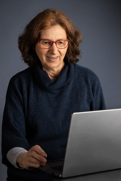Person holding blue ballpoint; picjumbo.com