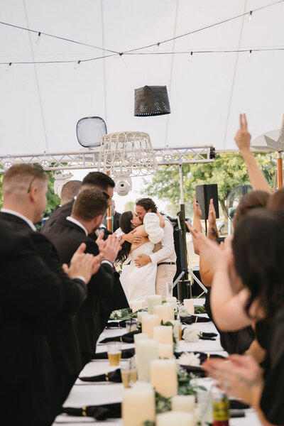 outdoor backyard wedding reception in tent located in Imlay City Michigan