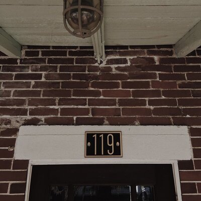 119 on the outside of Hillcrest Coffee bungalow