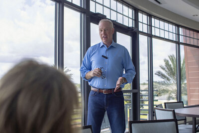 Mark Sullivan in a blue shirt and blue jeans leading a workshop – Life and Health Coach at LifeNBalance Coaching14