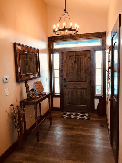Entry way interior with custom front door and trim