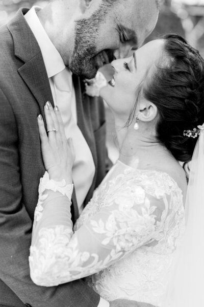 Bride and groom kiss after taking their wedding vows