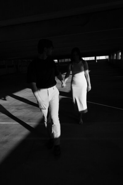 Couple in parking garage taken by 35mm film wedding photographer Noble Photo Co