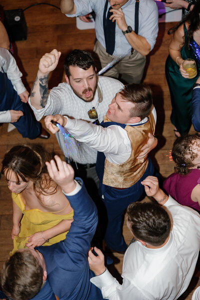 Wedding guests dancing at a reception