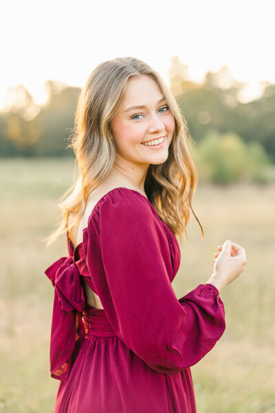 girl smiling in a red dress