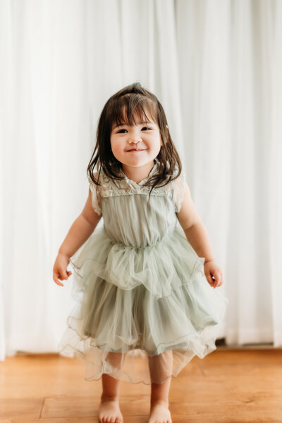 toddler making silly faces during a studio personality portrait session