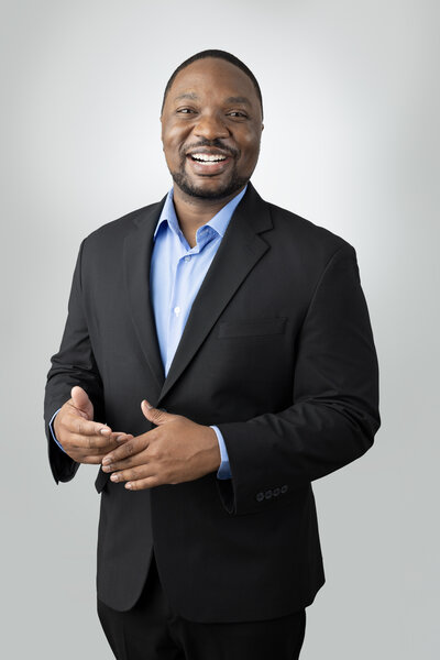 Headshot of smiling black man in suit