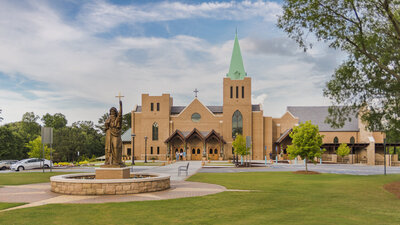 Church with copper steeple and freshly painted parking lot