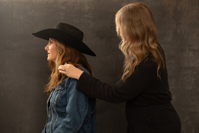 Austin, TX Makeup Artist Assisting a Client on set