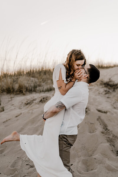 couple kissing on the beach