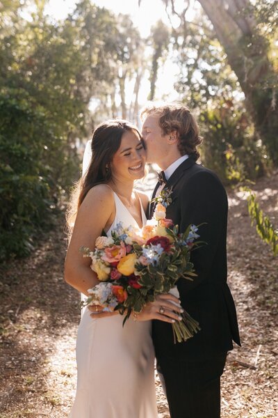 indie west portfolio image of bride and groom kissing on wedding day