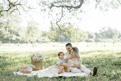mom dad and daughter picnic in the park Miami photography