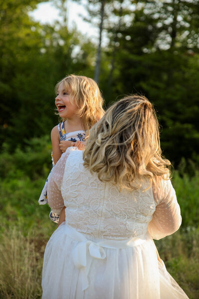 Mother holding daughter | Family Photos