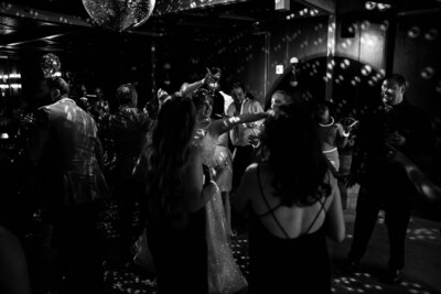 Bride and groom kissing in front of District Winery