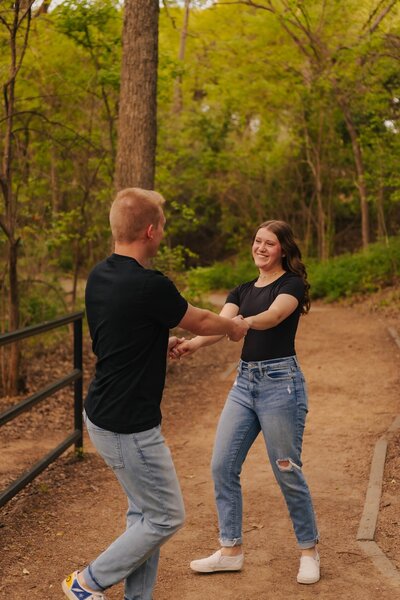 couple holding hands for their engagement session in dallas texas