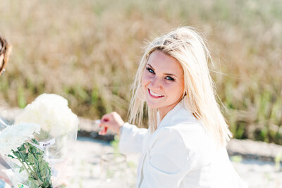 Stacie Hawkins looking back in white shirt