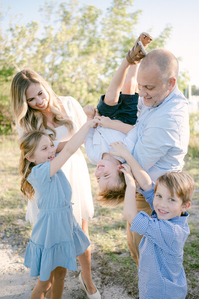 Family of five tickling each other by Miami Family Photographer