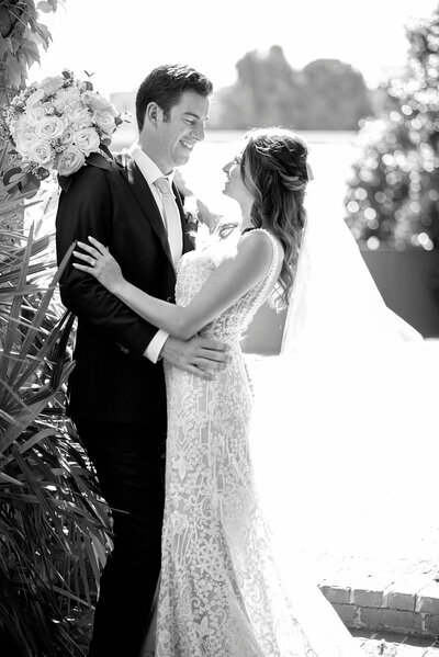 Couple embracing in the courtyard of Summerour Studio after their first look