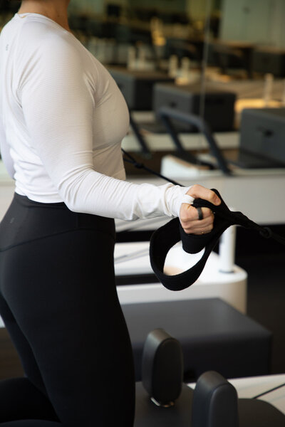 Woman in a reformer pilates class at Together old city
