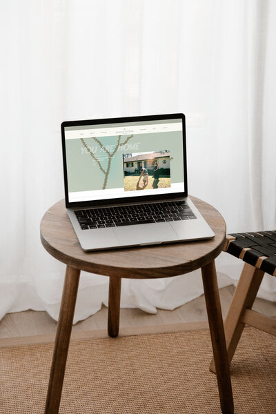 Laptop website mockup done during showit theme customization with Palme Design Co