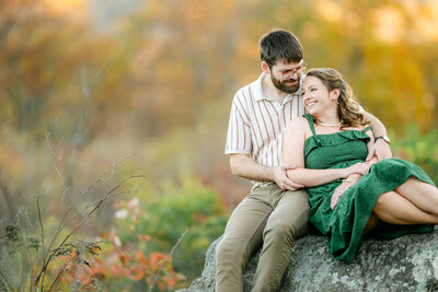 Nathan Sottung and his fiancée Jessica pose for a portrait at Shenandoah National Park, captured by Alexis El Massih Photography, showcasing their love and connection in a stunning natural setting.