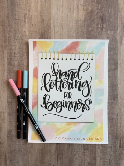 Rainbow gradient hand lettering workbook with hand lettering pens