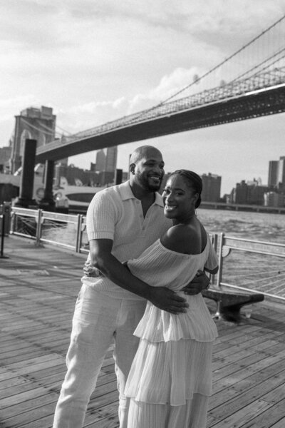 Bride leading groom engagement shoot