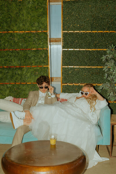 couple on blue couch wedding