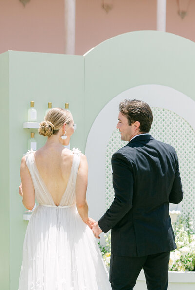 Bride and groom share a joyful moment at their luxury wedding at The Atlanta History Center’s Swan House & Gardens. A refined and timeless celebration in an iconic Southern venue.