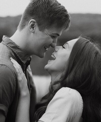 Couple laughing noses close together