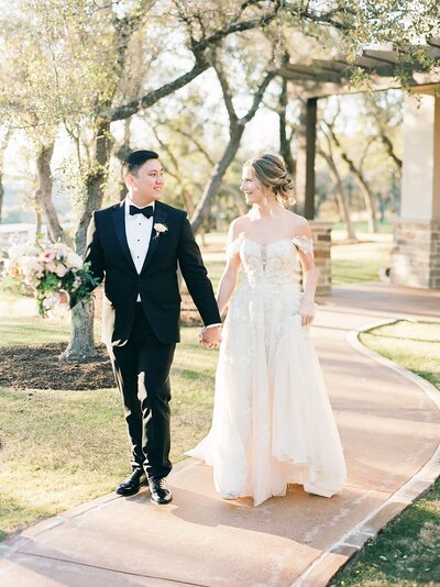 bride and groom in golden hour light at canyonwood ridge wedding venue in texas hill country