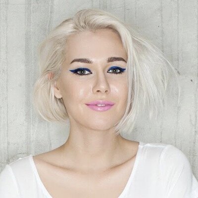 girl with white blond hair and vibrant makeup