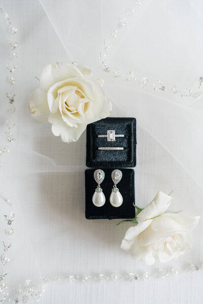 Detail Shot of Earings and Wedding Engagement Ring and Band