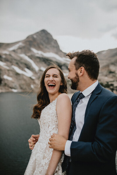 Couple laughing together in Colorado after getting married