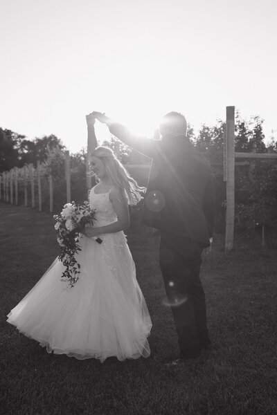 photo of bride being twirled by groom taken by Southeast Wisconsin photography studio