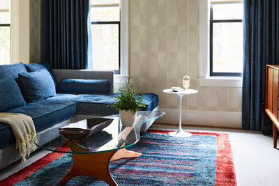 A historic home in Brookline featuring modern furniture and curated art by interior designers in Boston, blending classic architecture with fresh style.