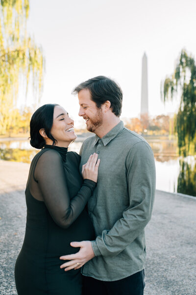 pregnant mom with husband by Washington Monument