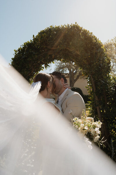 couple kissing during elopement in orange county