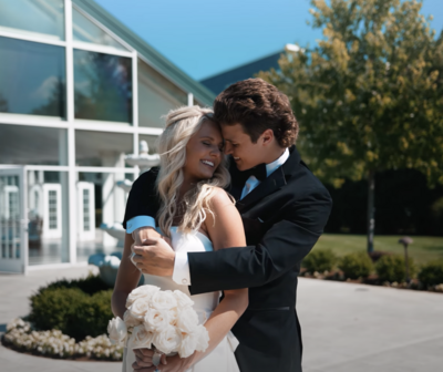 newlywed couple hugging