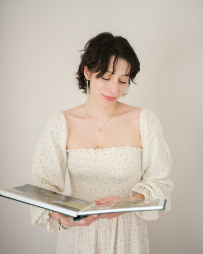 huntsville family photographers holding heirloom albums